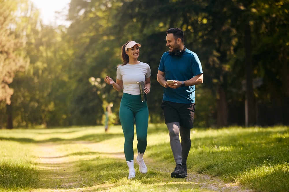 happy couple walking on hike.